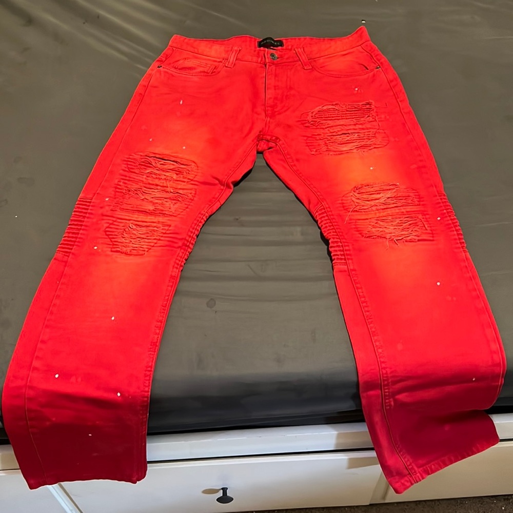 Red Decibel ripped jeans/ white paint splash design